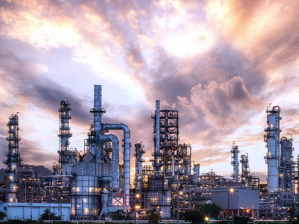 Oil refinery in the sunset using heat exchangers